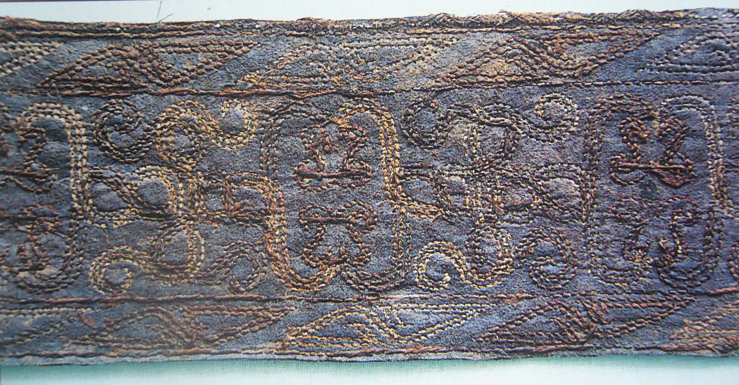 A silk embroidered belt of the Warring States Period preserved in Jingzhou Museum, Hubei Province.