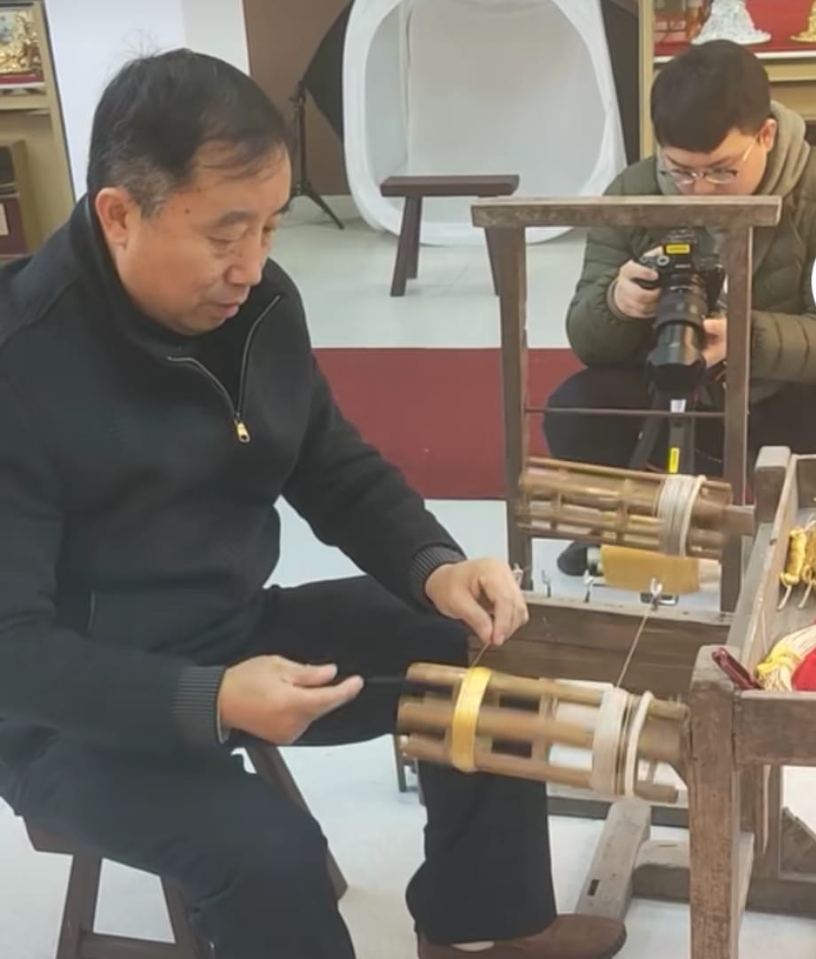 Pure gold embroidery thread being made