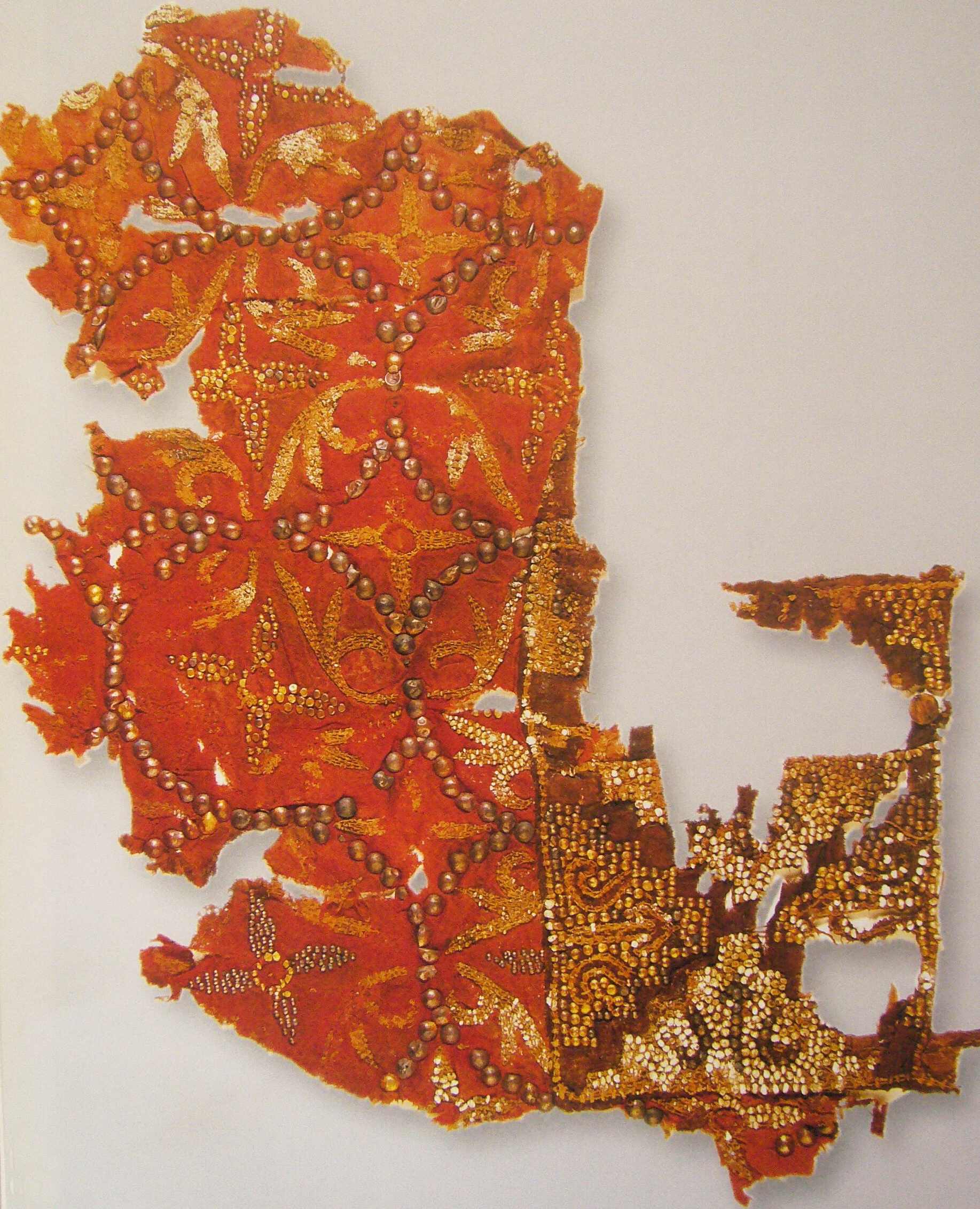 FIG. 16 A remaining piece of bead work embroidery in the Tang Dynasty preserved in the Administration Office of Cultural Relics, Kazakh Autonomous Prefecture, Xinjiang Uygur Autonomous Region.